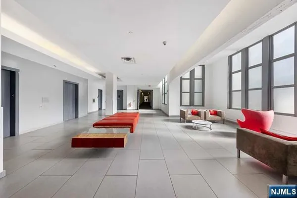 a living room with furniture and white walls