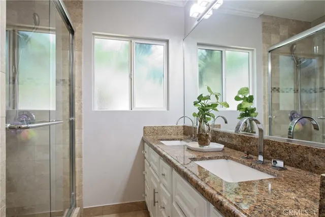 a bathroom with sink and mirror