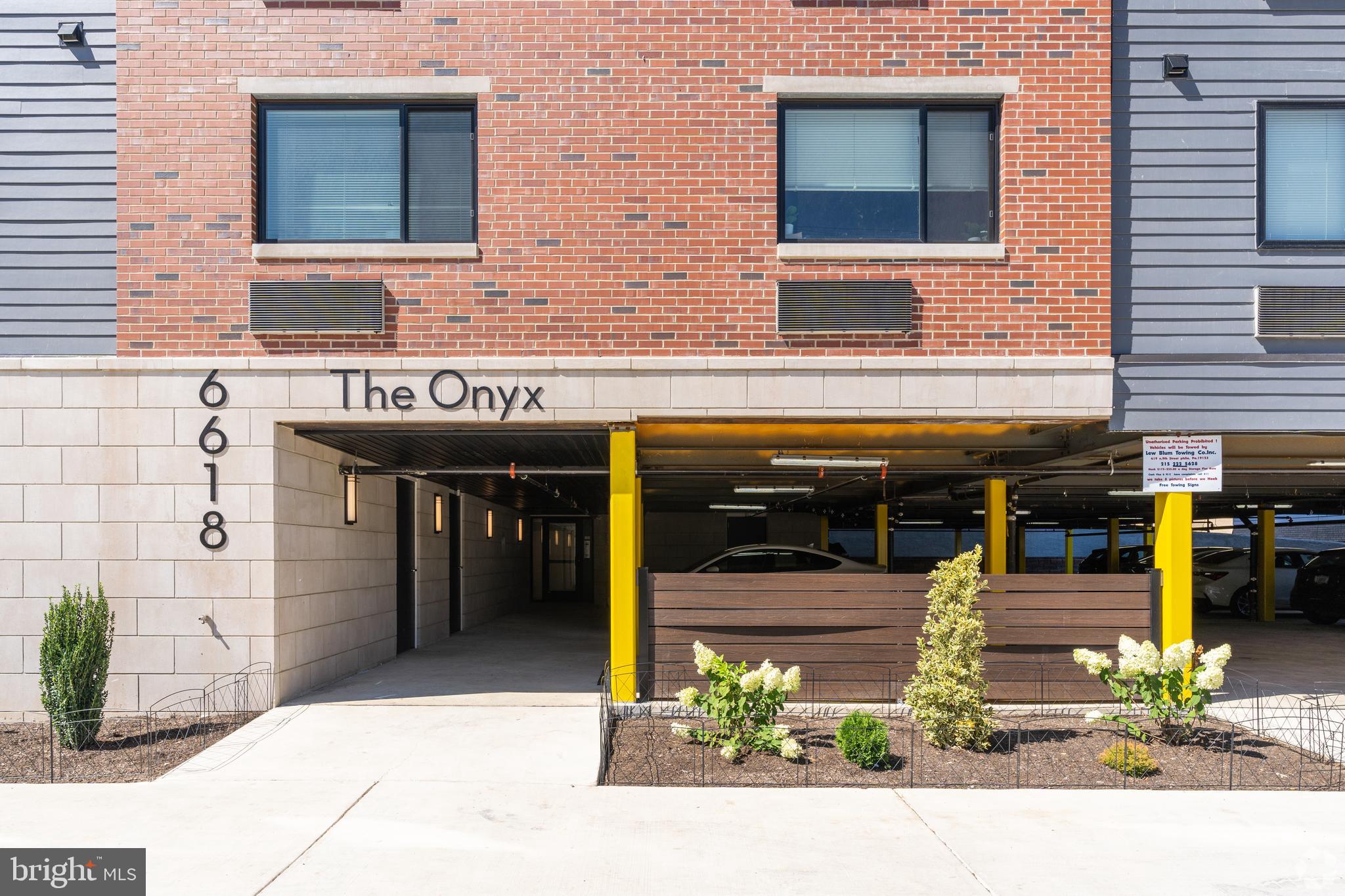 6618 Ridge Avenue, Unit 307 Philadelphia, PA 19128 - Photo 15 of 15 a view of a building with an outdoor space