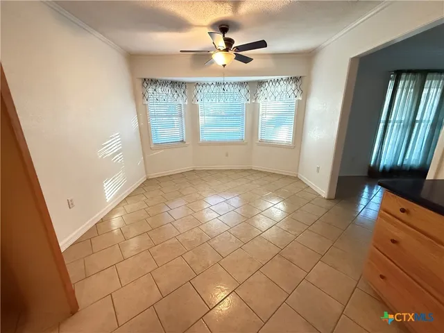 a view of an empty room and window