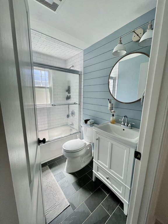 4 Carter Road Woburn, MA 01801 - Photo 14 of 28 a bathroom with a sink a toilet and vanity