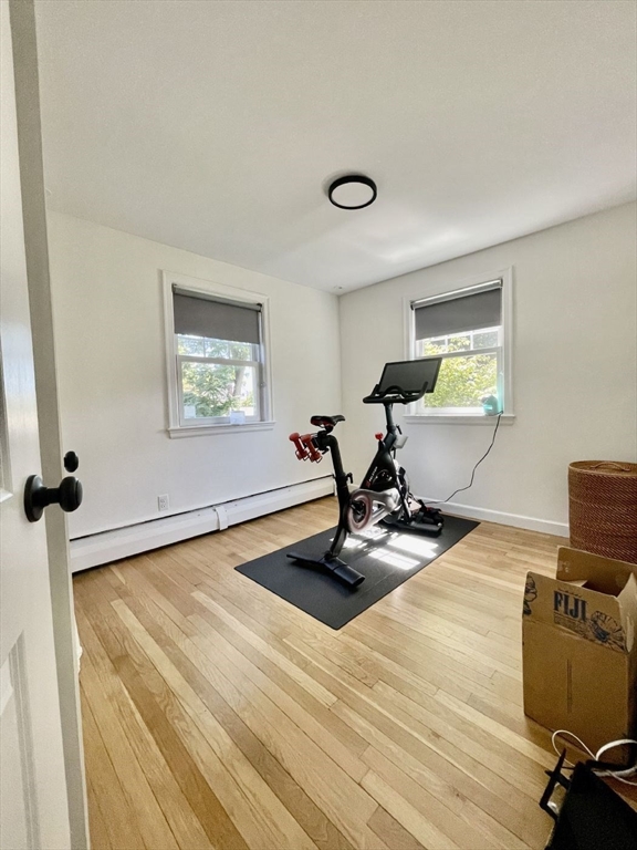 4 Carter Road Woburn, MA 01801 - Photo 15 of 28 a room with gym equipment and a window