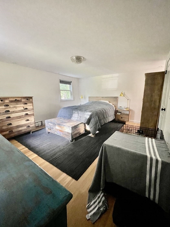 4 Carter Road Woburn, MA 01801 - Photo 16 of 28 a bedroom with two beds and a desk