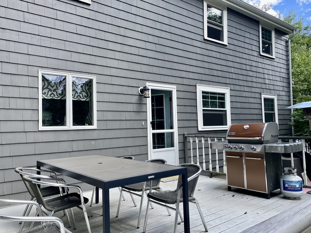 4 Carter Road Woburn, MA 01801 - Photo 24 of 28 a backyard of a house with seating space