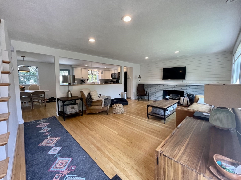 4 Carter Road Woburn, MA 01801 - Photo 4 of 28 a living room with furniture and a fireplace