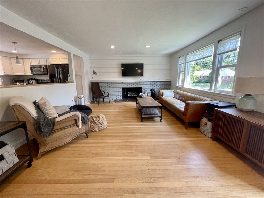 4 Carter Road Woburn, MA 01801 - Photo 5 of 28 a living room with furniture and a flat screen tv