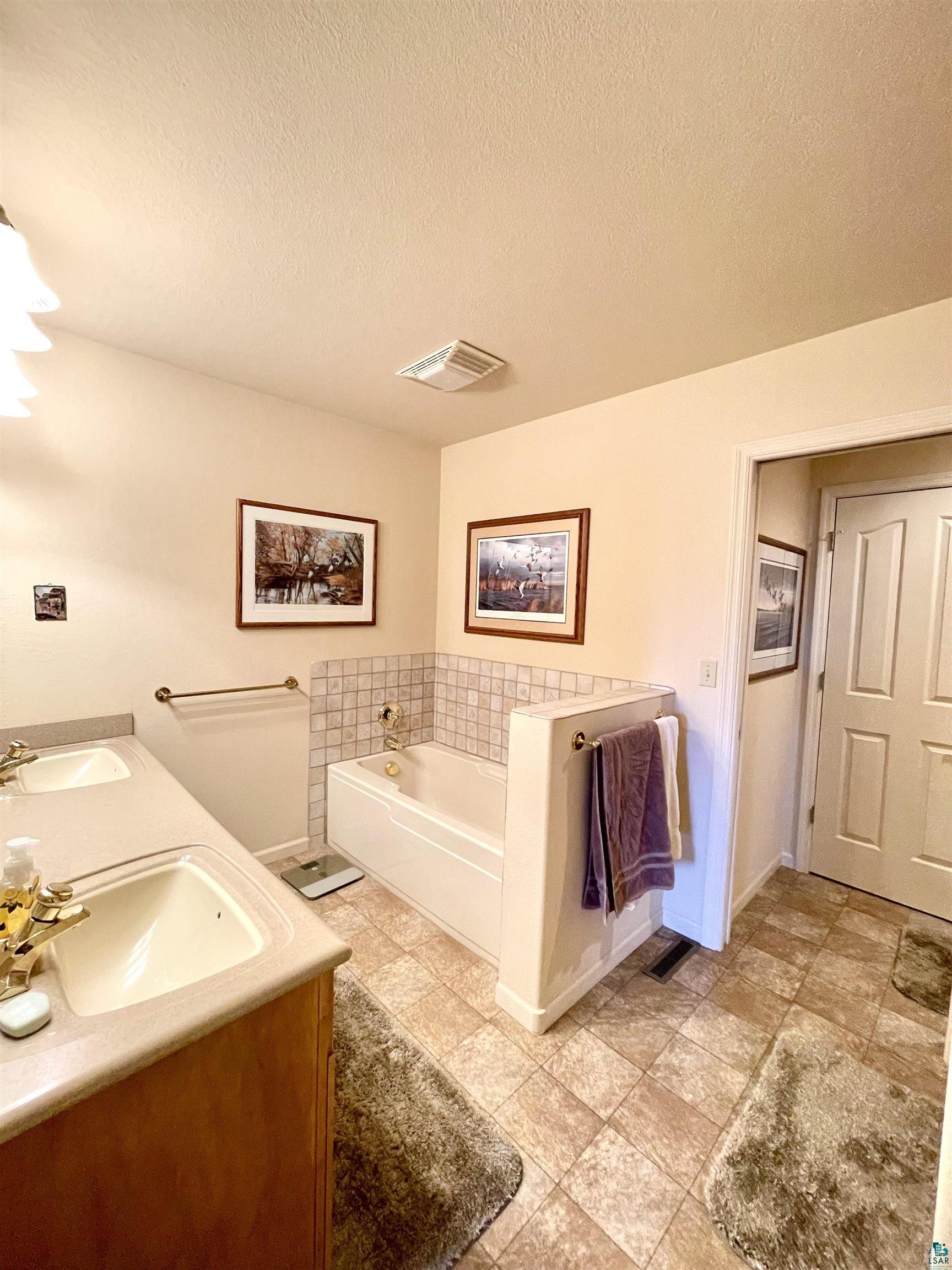 183 Cramer Road Schroeder, MN 55613 - Photo 21 of 50 Main floor master bath.