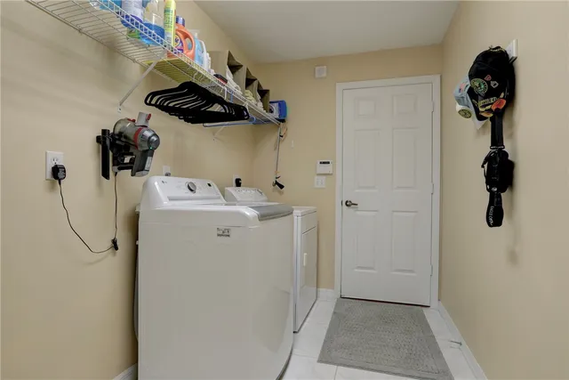 a view of a dining room with furniture large windows and wooden floor
