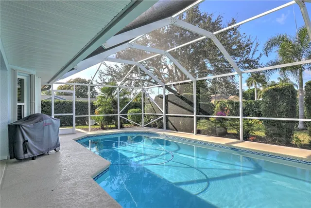 a view of a hall with dining area and chandelier