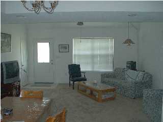2804 Mac Gregor Lane Crestview, FL 32539 - Photo 3 of 3 a living room with furniture and a flat screen tv