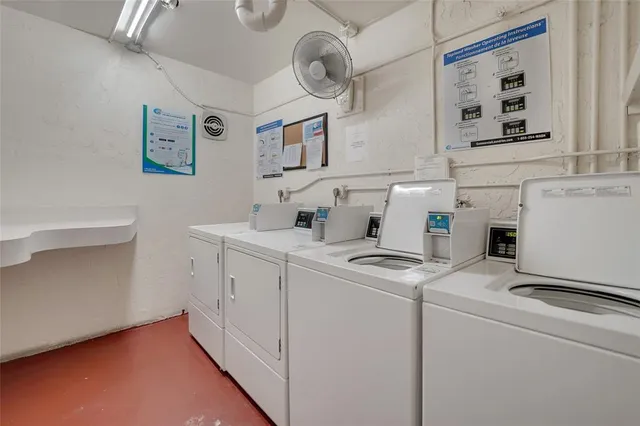 a view of storage and utility room with washer and dryer