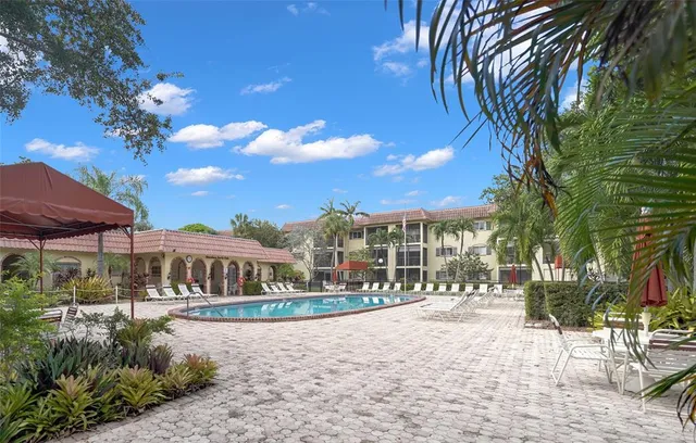 a view of a building with a yard