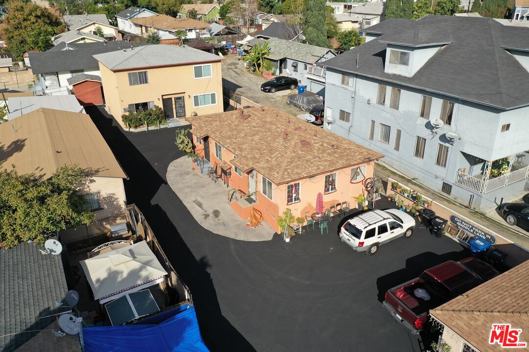 an aerial view of a house with roof deck