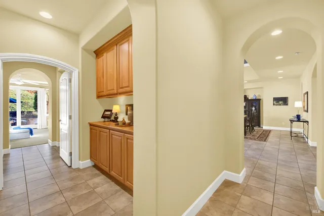 an aerial view of residential houses with outdoor space and swimming pool
