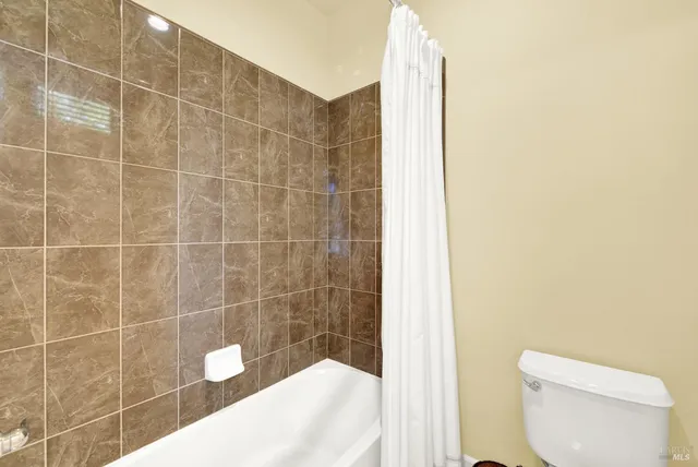 a view of a lake with a table and chairs