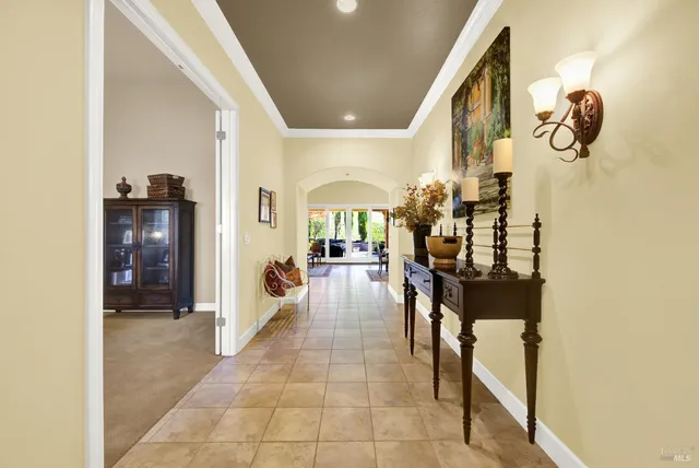 a kitchen with counter top space and living room view
