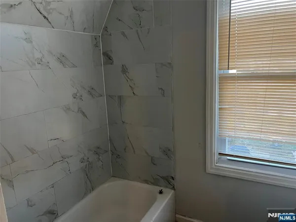 a bathroom with a small window