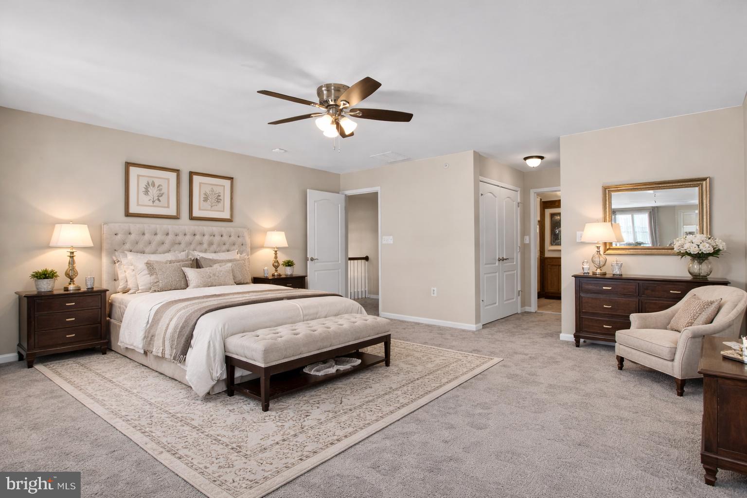 2228 Highfly Terrace, Unit 2228 Silver Spring, MD 20902 - Photo 19 of 35 a spacious bedroom with a bed and furniture