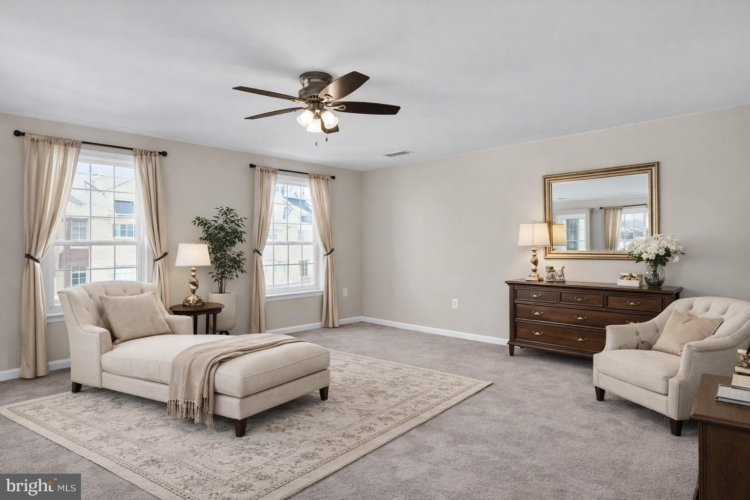 2228 Highfly Terrace, Unit 2228 Silver Spring, MD 20902 - Photo 20 of 35 a bedroom with a large bed and a couch