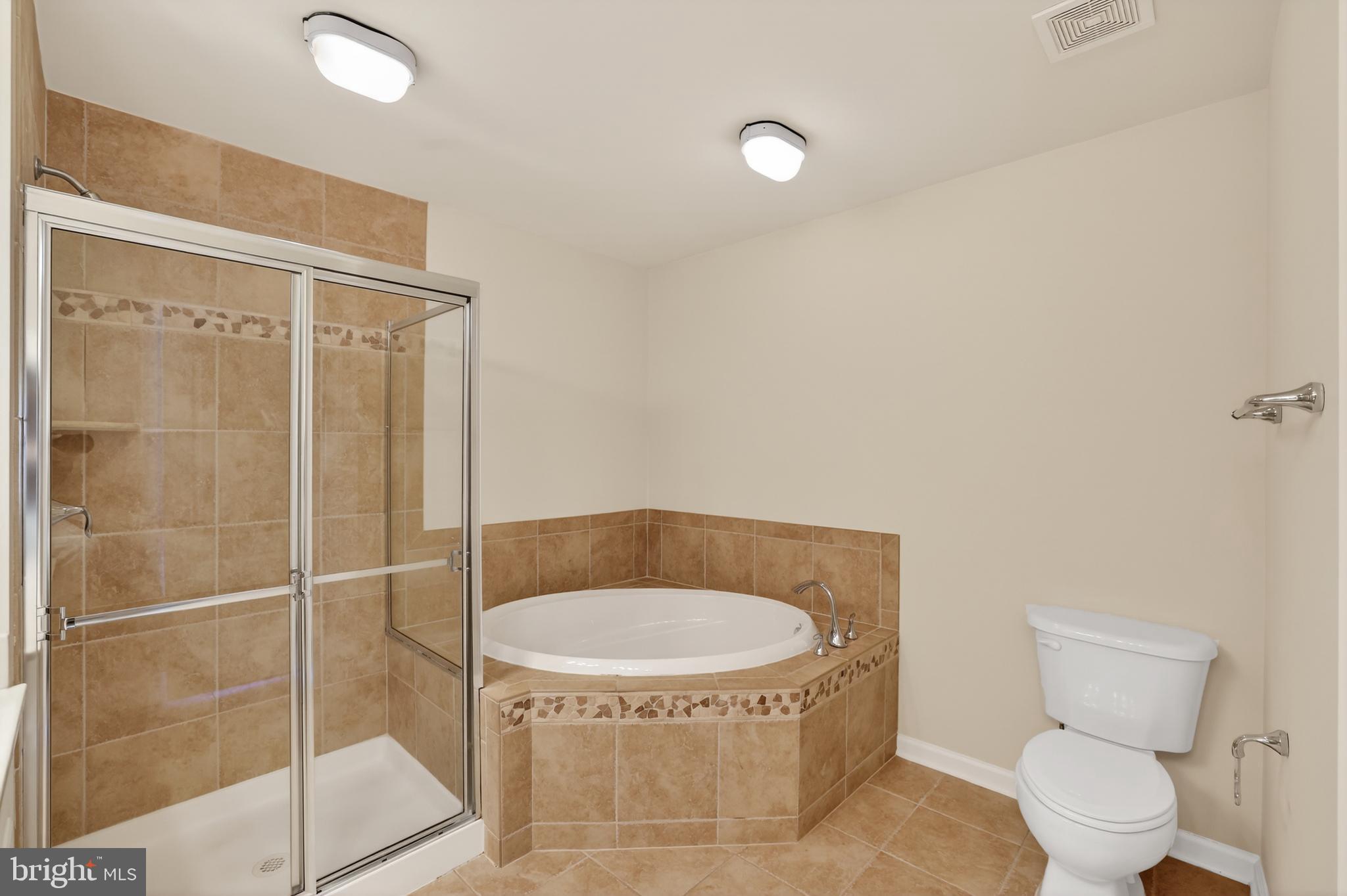 2228 Highfly Terrace, Unit 2228 Silver Spring, MD 20902 - Photo 24 of 35 a bathroom with a toilet and a shower