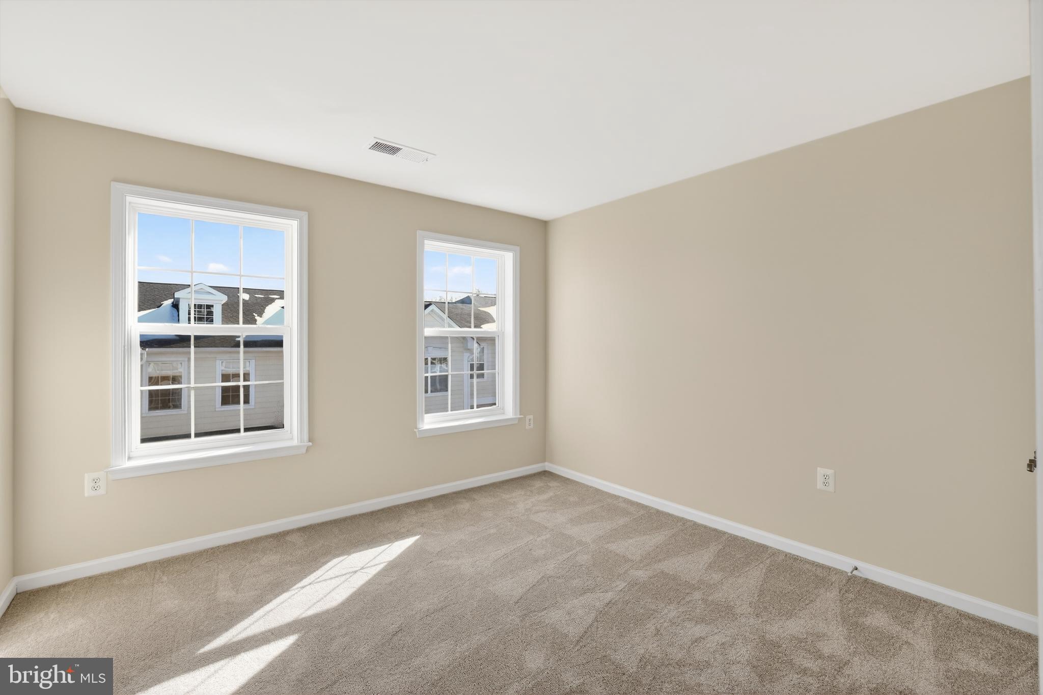 2228 Highfly Terrace, Unit 2228 Silver Spring, MD 20902 - Photo 26 of 35 a view of an empty room with a window