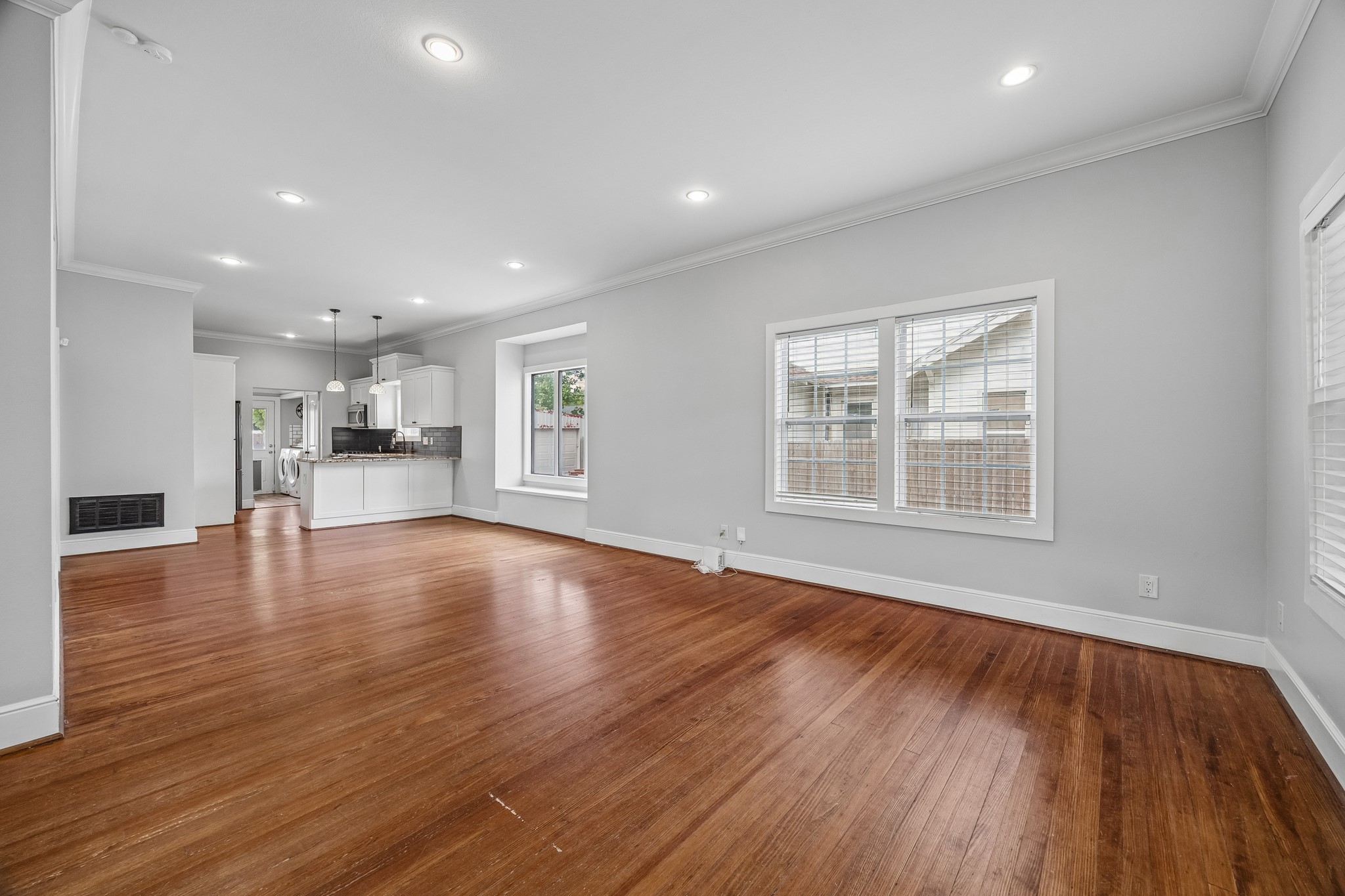 4412 Rusk Street Houston, TX 77023 - Photo 7 of 44 Another view of expansive living spaces open to beautifully appointed kitchen.