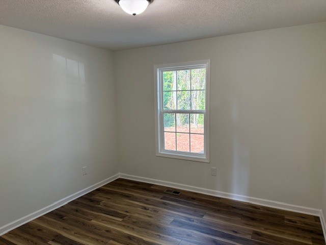 22 Ghea Road Normandy, TN 37360 - Photo 26 of 40 an empty room with wooden floor cabinet and windows