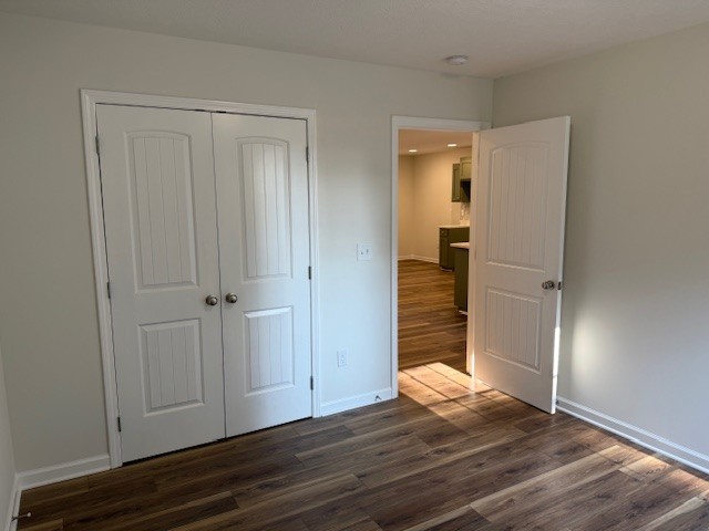 22 Ghea Road Normandy, TN 37360 - Photo 33 of 40 a view of an empty room with wooden floor and a bathroom