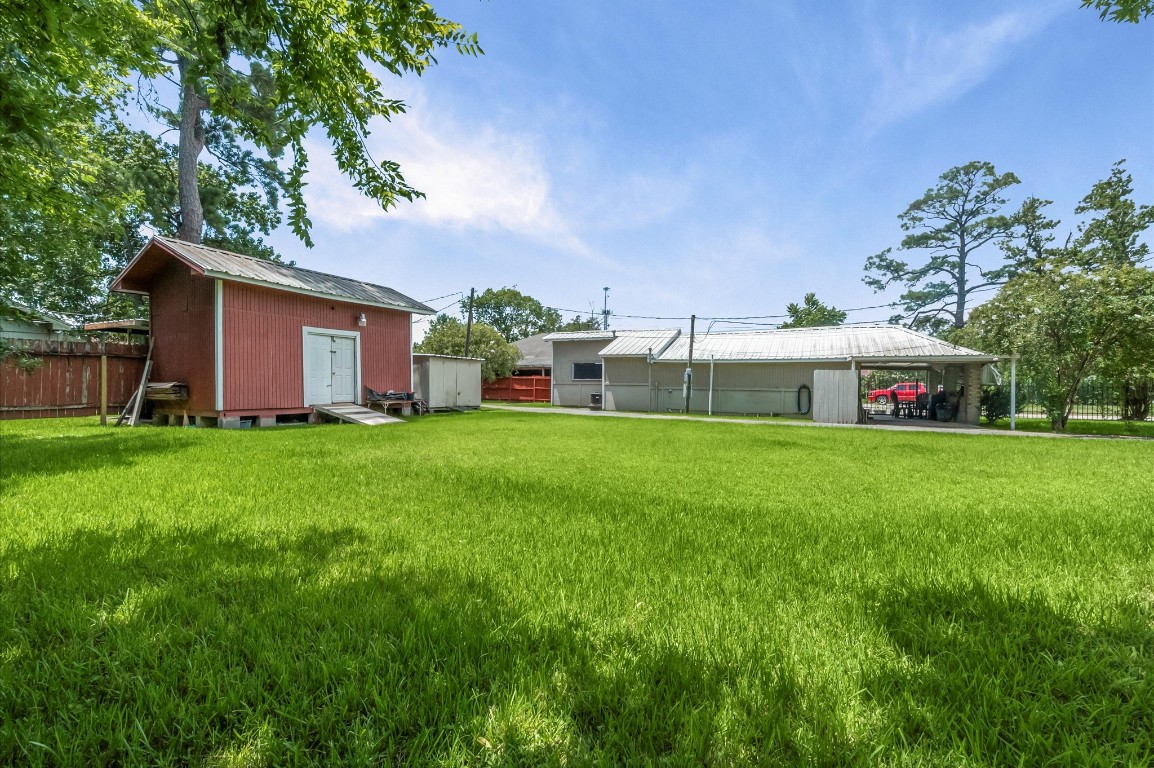 16032 1/2 Ridlon Street Channelview, TX 77530 - Photo 19 of 40 a house view with swimming pool in front of it