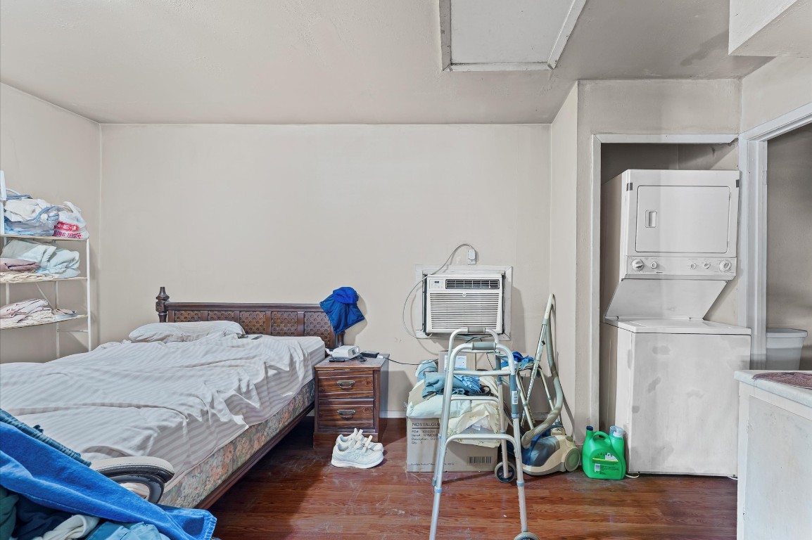 16032 1/2 Ridlon Street Channelview, TX 77530 - Photo 25 of 40 a bedroom with a bed and wooden floor