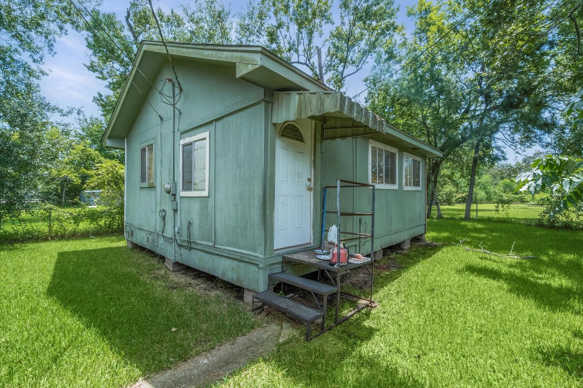 16032 1/2 Ridlon Street Channelview, TX 77530 - Photo 7 of 40 a view of backyard with deck and garden