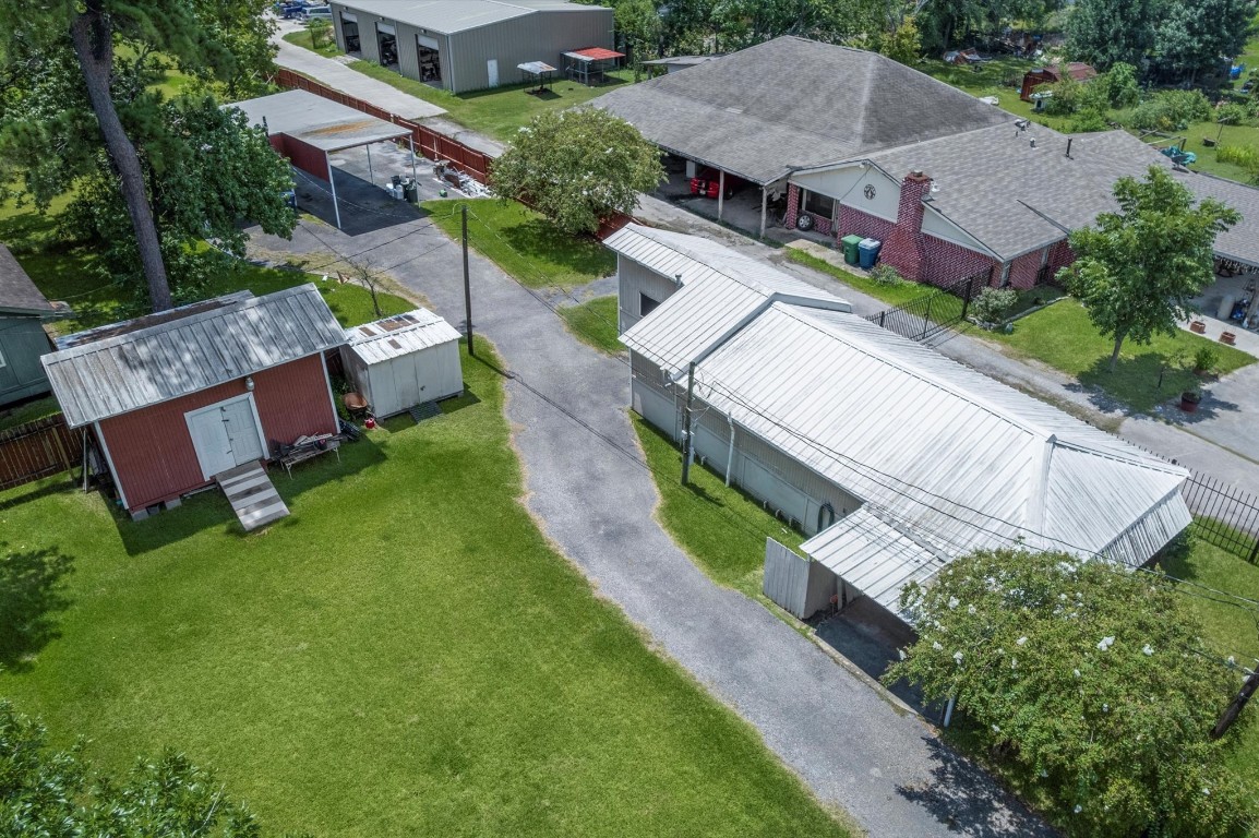 16032 1/2 Ridlon Street Channelview, TX 77530 - Photo 9 of 40 an aerial view of a house with a garden and plants
