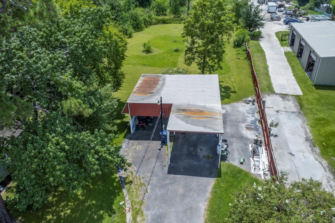 16032 1/2 Ridlon Street Channelview, TX 77530 - Photo 10 of 40 an aerial view of a house with swimming pool and large trees