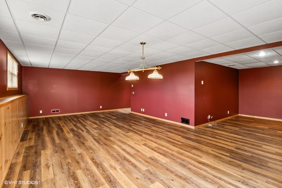 1502 Pine Street Spring Grove, IL 60081 - Photo 20 of 29 a view of empty room with wooden floor