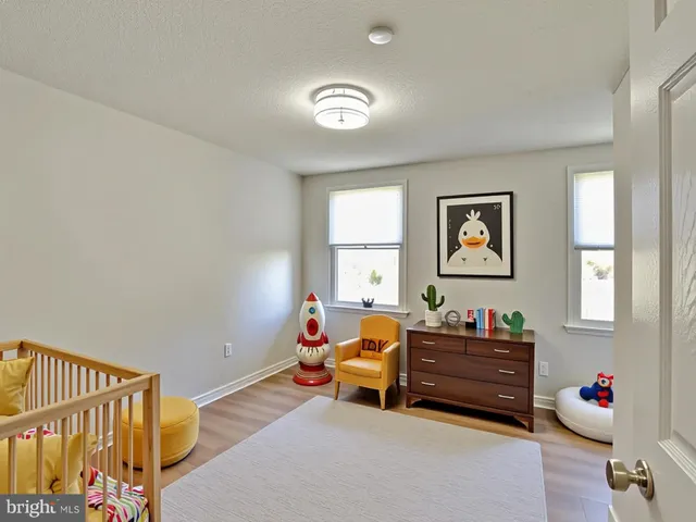 a bedroom with bed and a window