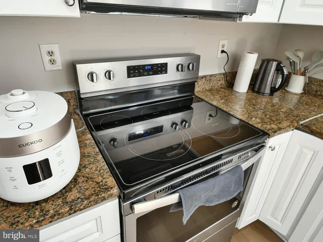 a close view of stove and microwave