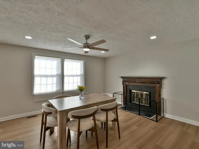 a workspace with furniture window and wooden floor