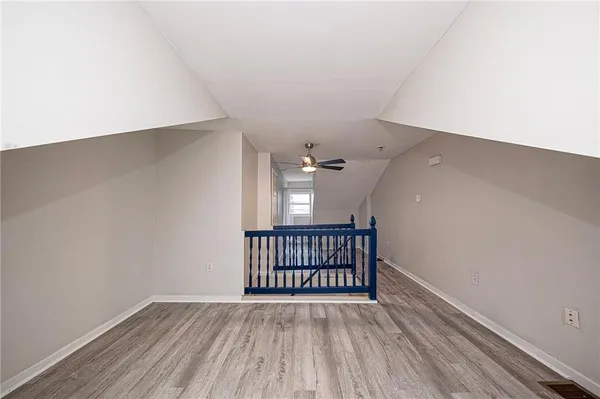 wooden floor in a hall with a window