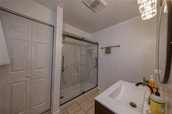 a bathroom with a sink and shower