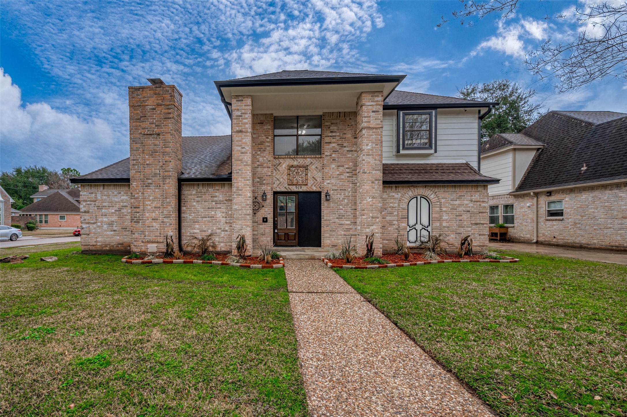 919 Mockingbird Way Sugar Land, TX 77478 - Photo 1 of 41 Two story home with beautifully maintained front yard, three car garage and striking chimney.