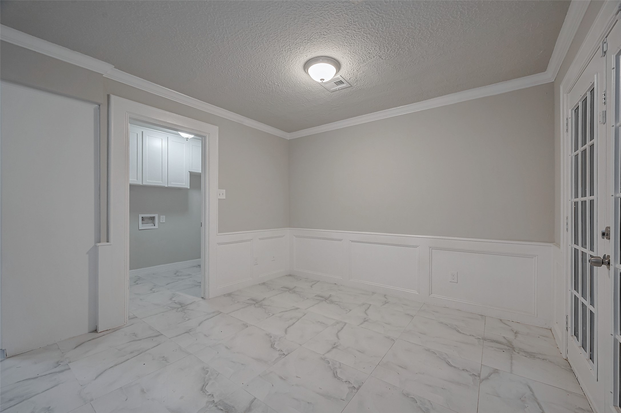 919 Mockingbird Way Sugar Land, TX 77478 - Photo 10 of 41 Spacious laundry area with elegant marble flooring.