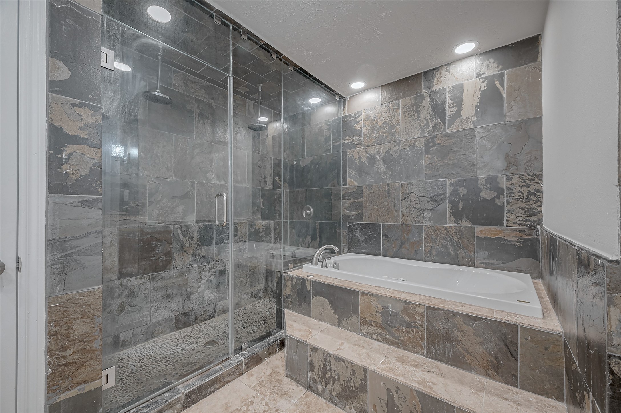 919 Mockingbird Way Sugar Land, TX 77478 - Photo 18 of 41 Luxurious bathroom featuring a sleek glass-enclosed shower.