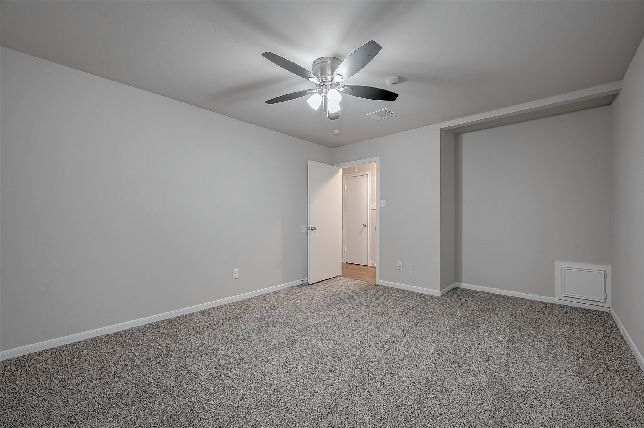 919 Mockingbird Way Sugar Land, TX 77478 - Photo 24 of 41 This room features soft grey walls, plush carpeting, and a ceiling fan with lights.