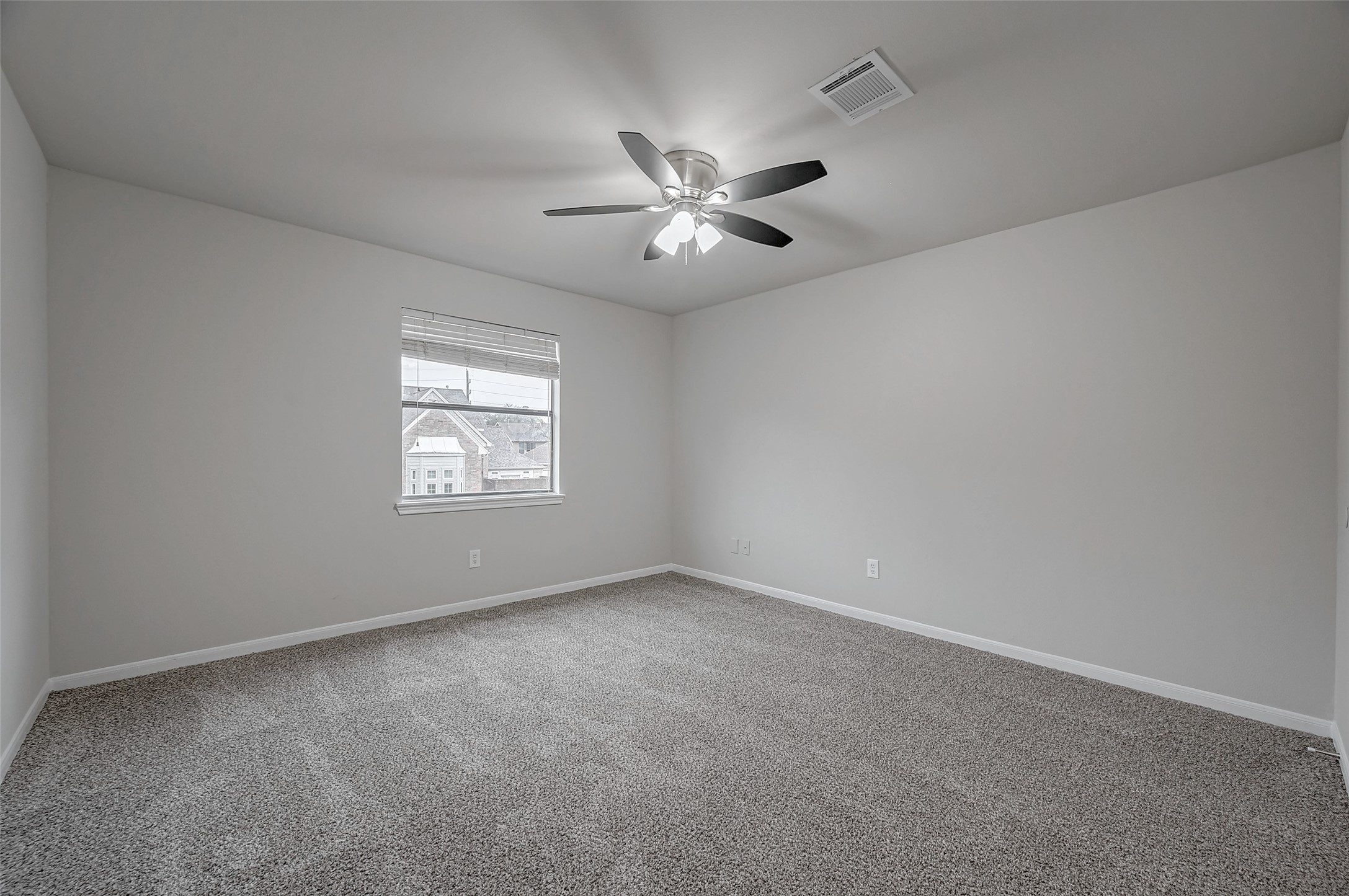 919 Mockingbird Way Sugar Land, TX 77478 - Photo 31 of 41 Bedroom featuring soft carpet flooring, a ceiling fan with lights, and a window.