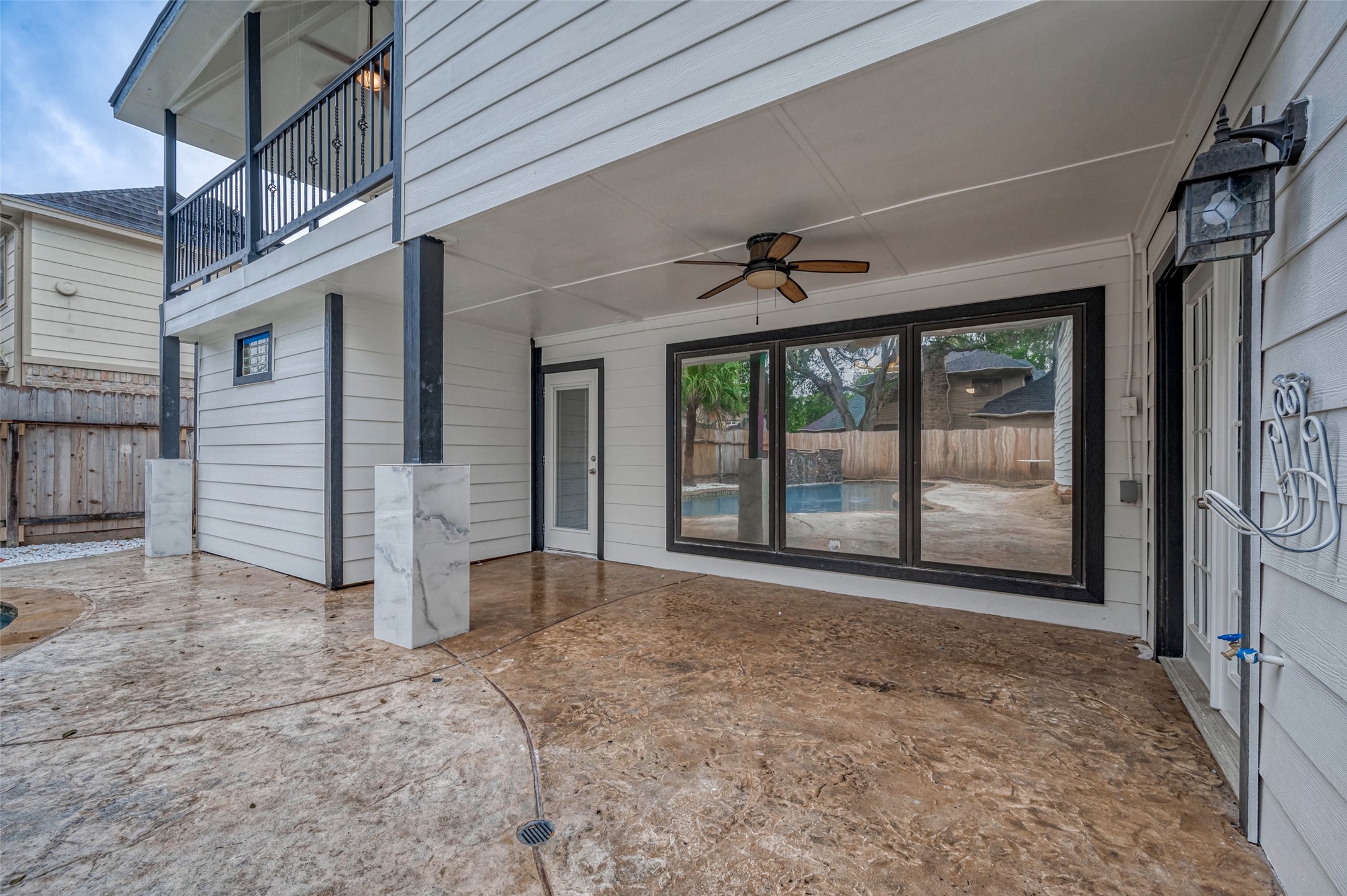 919 Mockingbird Way Sugar Land, TX 77478 - Photo 37 of 41 Inviting covered patio with expansive glass doors.