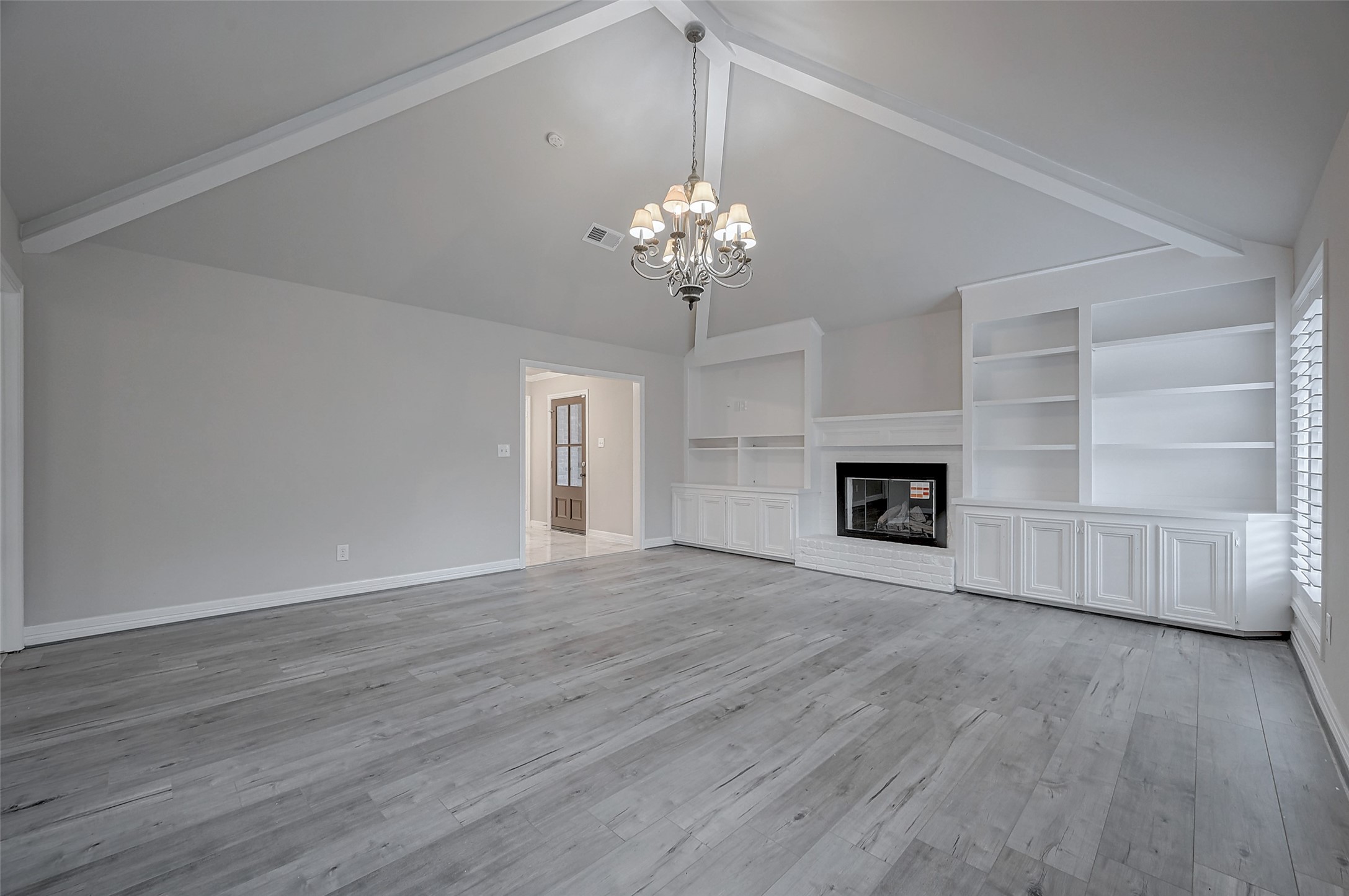 919 Mockingbird Way Sugar Land, TX 77478 - Photo 6 of 41 Built-in shelving, and a cozy fireplace in the living room.