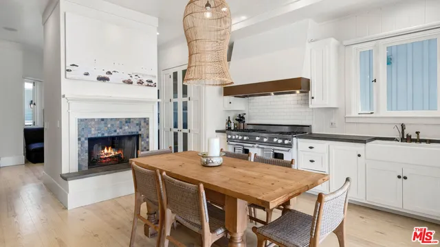 a bathroom with a sink a toilet a mirror and shower