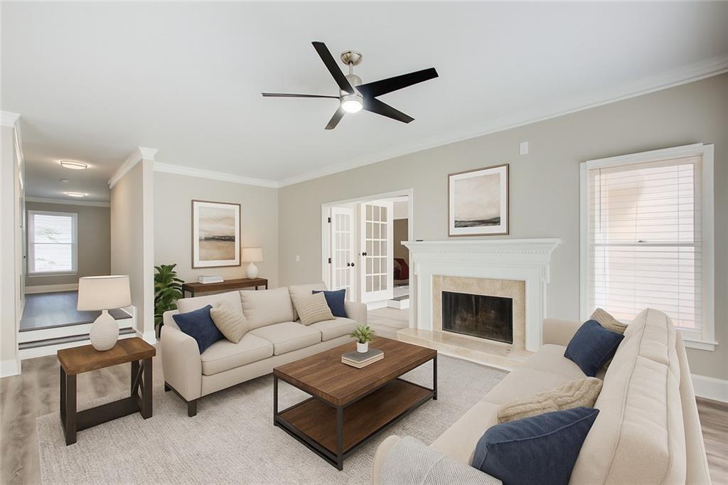 3 South Riversong Lane Alpharetta, GA 30022 - Photo 4 of 23 a living room with furniture a fireplace with wooden floor