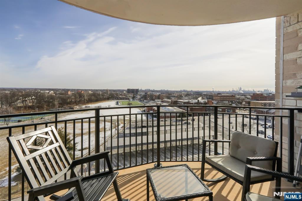 150 Overlook Avenue, Unit 7F Hackensack, NJ 07601 - Photo 32 of 33 a view of a balcony with wooden chairs