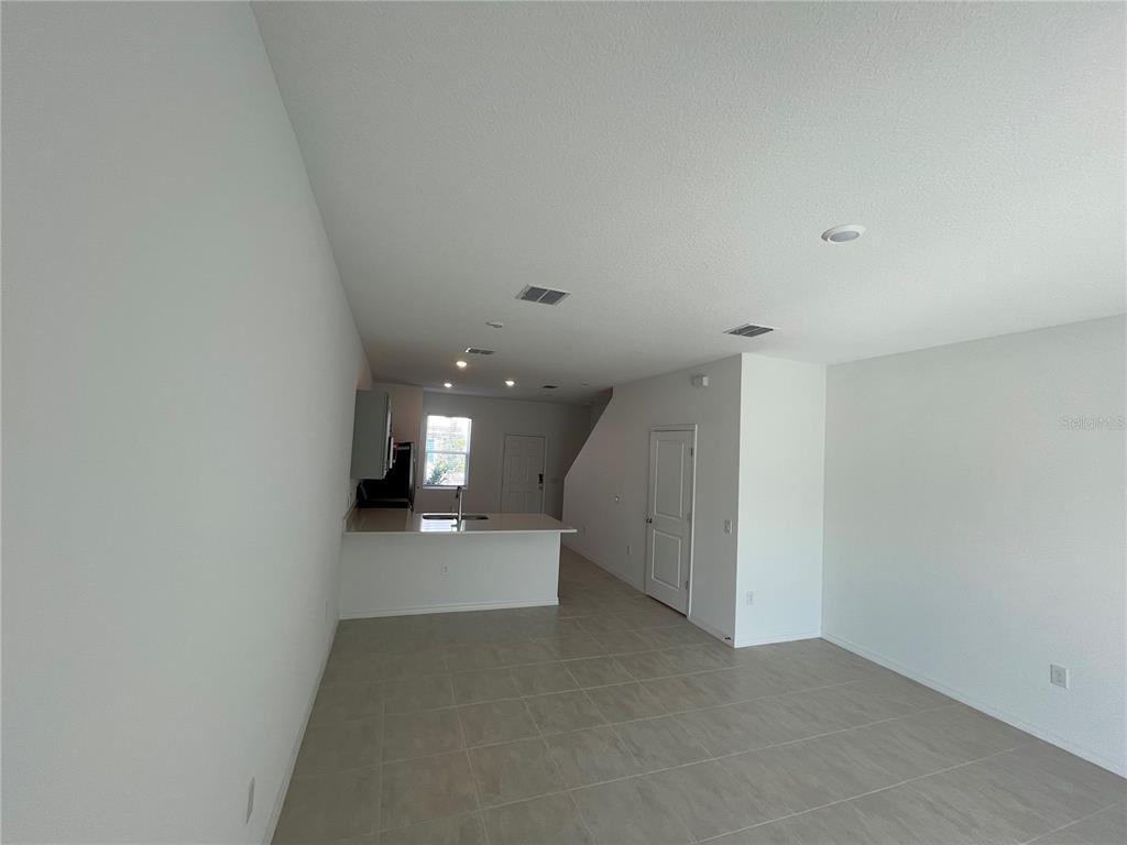 2995 Skyline Loop Kissimmee, FL 34758 - Photo 13 of 46 a view of a hallway with stairs